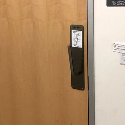 Wrist pull installed on a bathroom door
