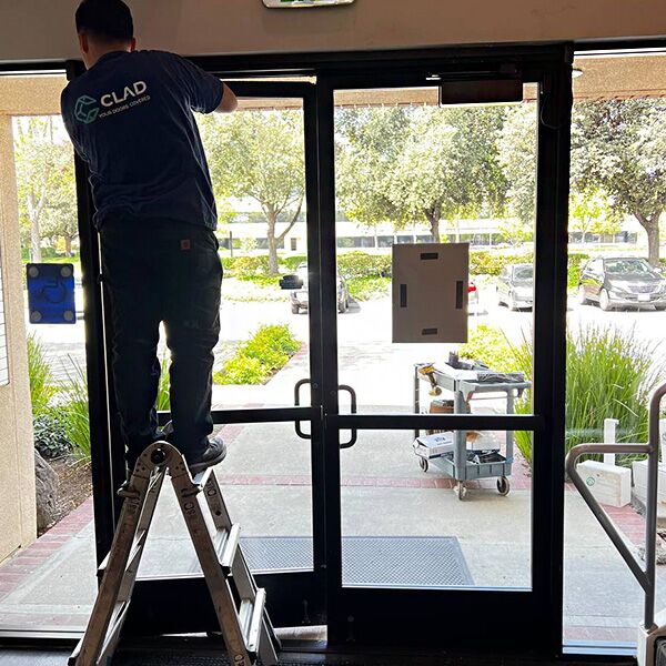 one of our techs is working on a commercial door repair in Tracy, California