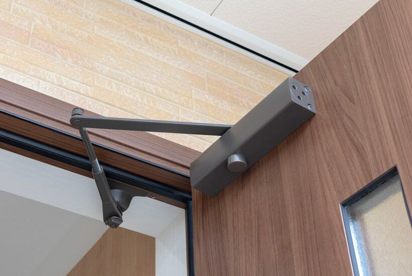 should an ADA bathroom door swing in or out?