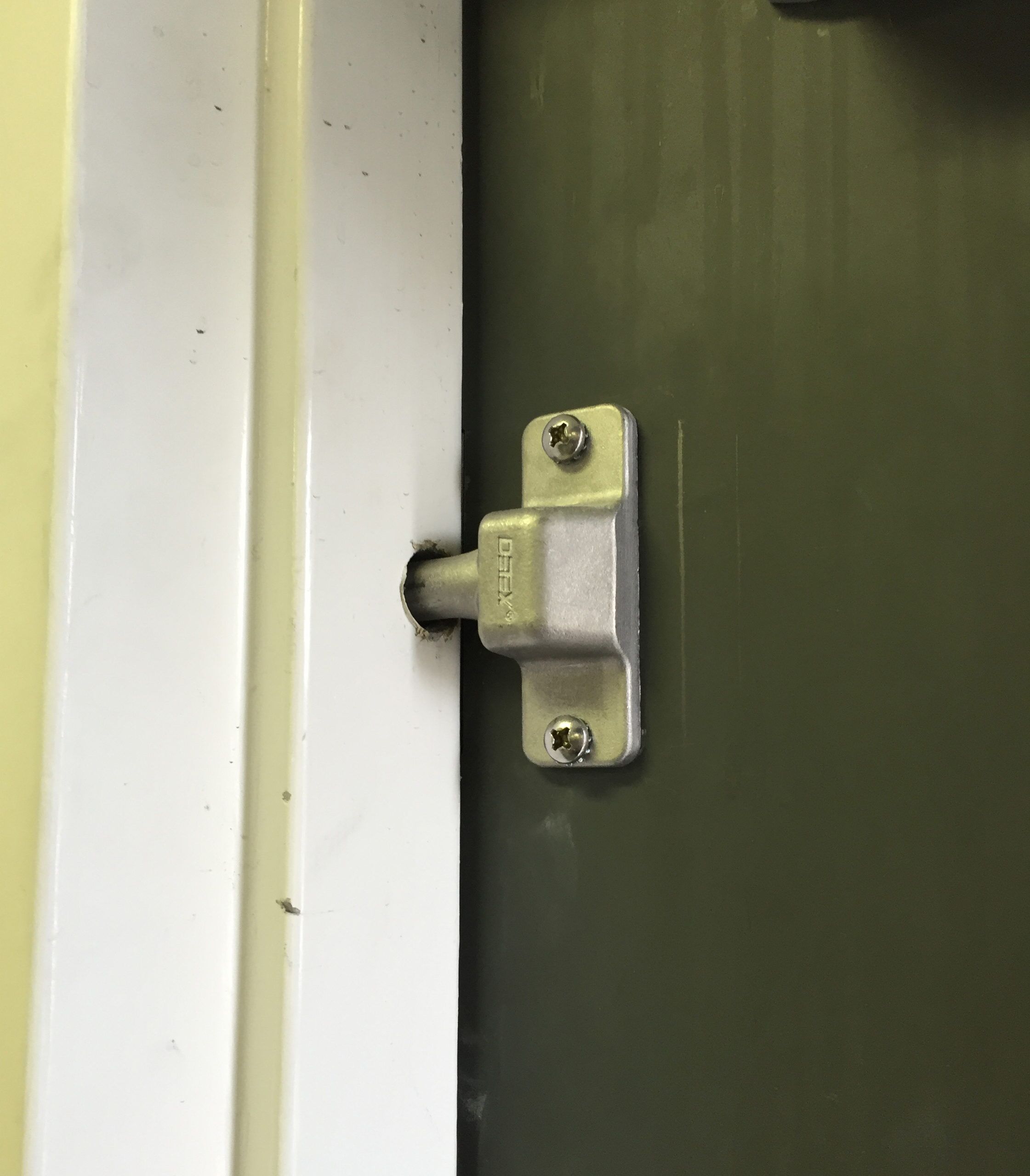 commercial locksmith services repairing a deadbolt door