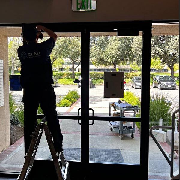 installing new aluminum glass storefront doors