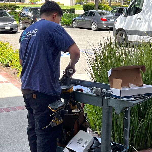 one of our locksmiths is working on a key duplication